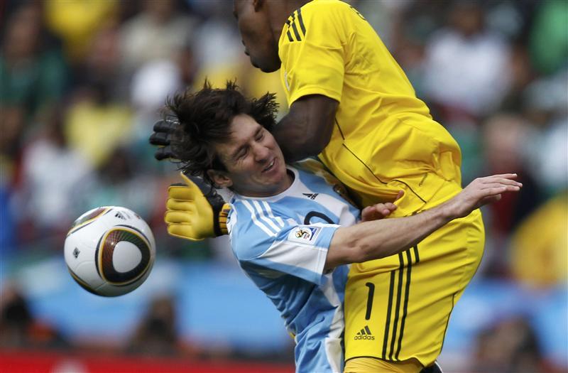 Argentina's Messi collides with Nigeria's goalkeeper Enyeama  during a 2010 World Cup Group B soccer match at Ellis Park stadium in Johannesburg