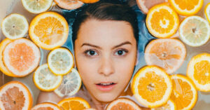 woman bath face oranges 1200x628 facebook 1200x628 1 1024x536 1