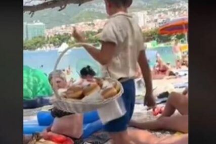“ZARADI IM 4 MJESEČNE PLATE” Snimak mališana kako prodaje krofne podigao lavinu, umjesto da osudi čin, on mu BROJAO PAZAR